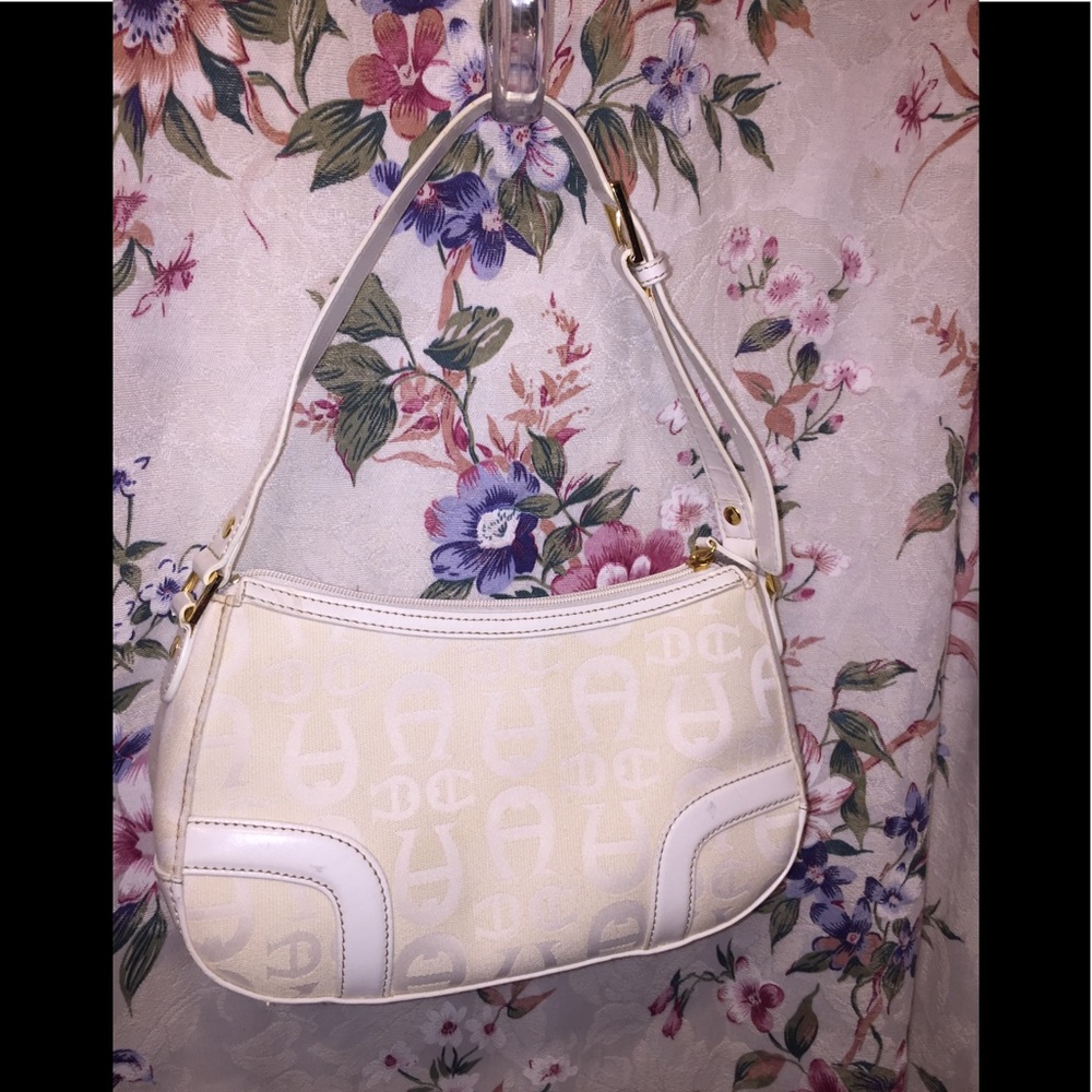 Etienne Aigner’s White Jacquard Signature Satchel